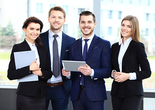 Happy smiling business team in office